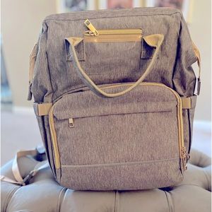 Diaper bag backpack with changing station